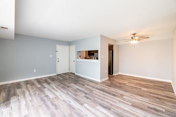 A room with a ceiling fan and a bar area at BellaVista Apartments in Woodbridge, VA